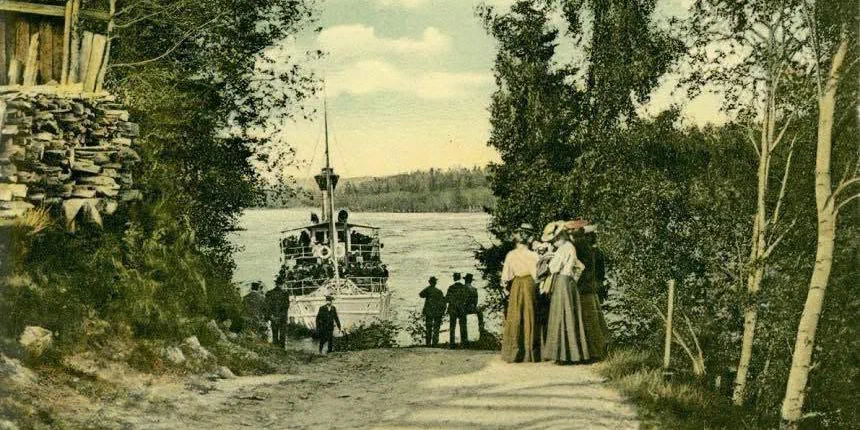 Historic photograph of people beside a passenger boat at a landing on Lake Marmen